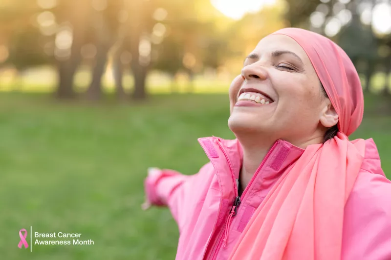 Lady enjoying the great outdoors, wearing her pink to honor Breast Cancer Awareness Month.