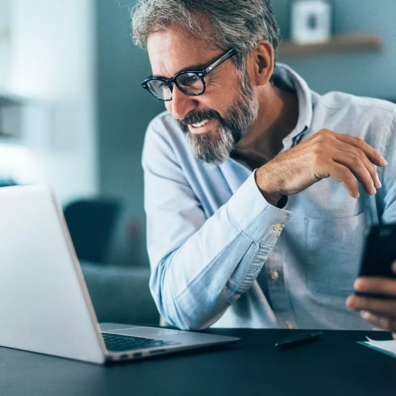 A man on his computer.