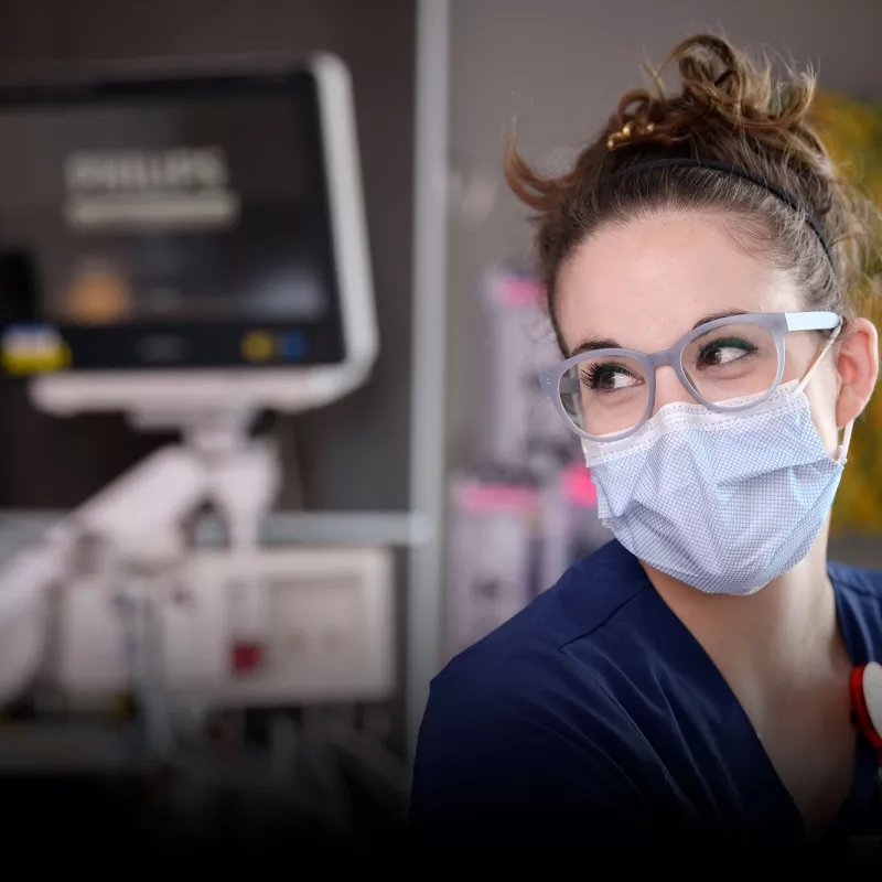 A nurse focusing her attention on someone