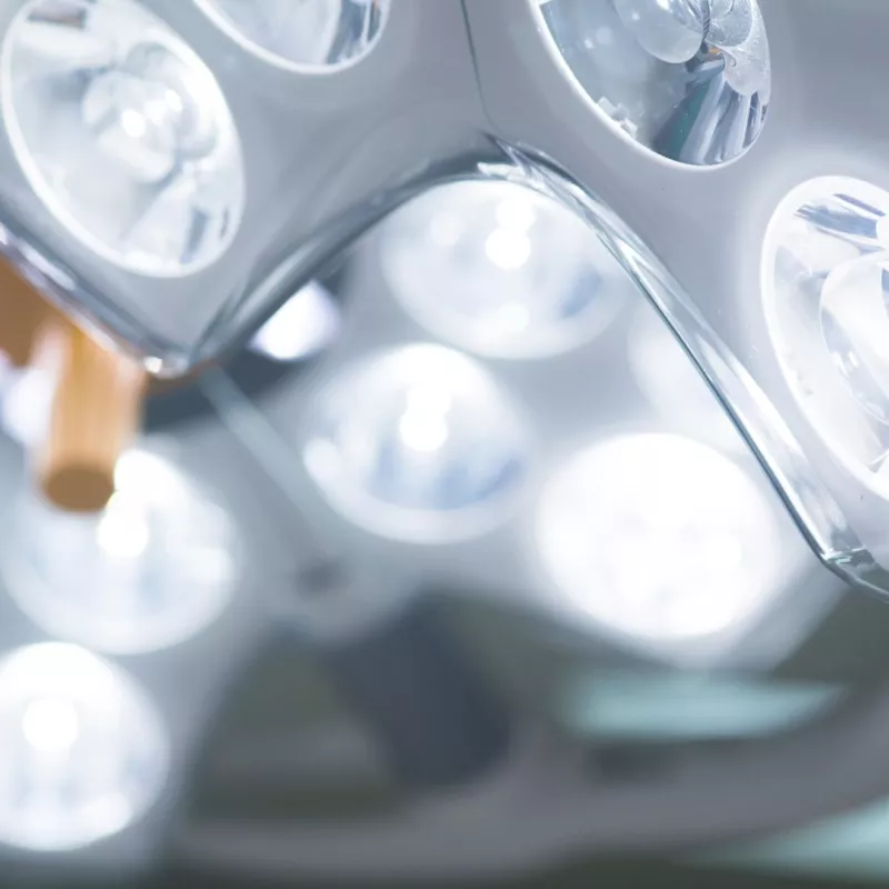 Spotlights above the table in an Hyrbid OR room